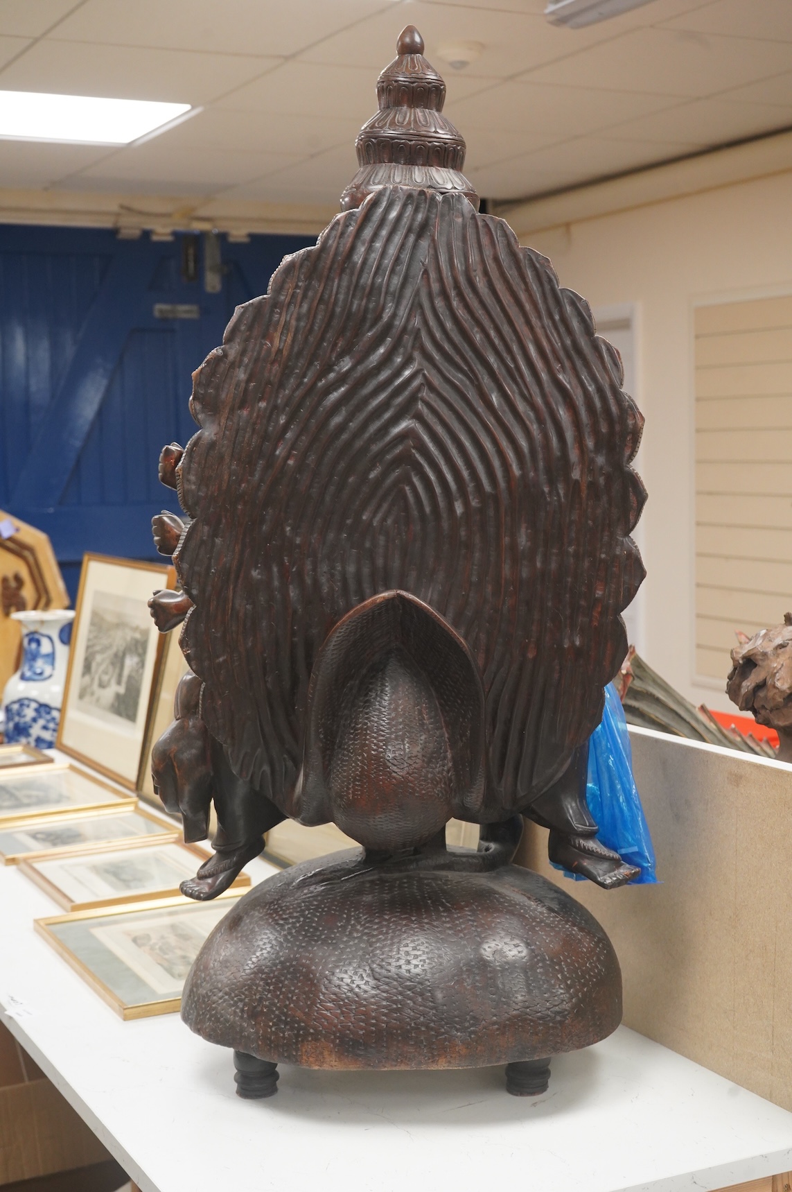 A large carved Ceylonese “Hindu Buddha” 108cm high